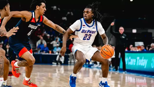 David Thomas looks for a pass while dribbling