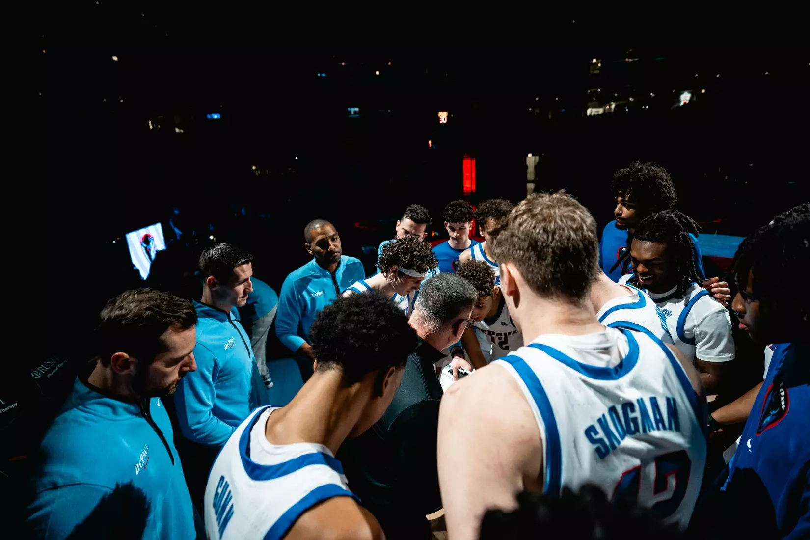 Team huddles before the game