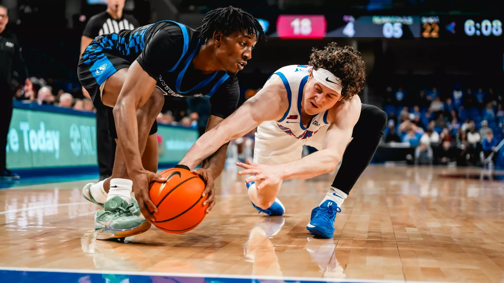Conor Enright goes to the ground for the basketball