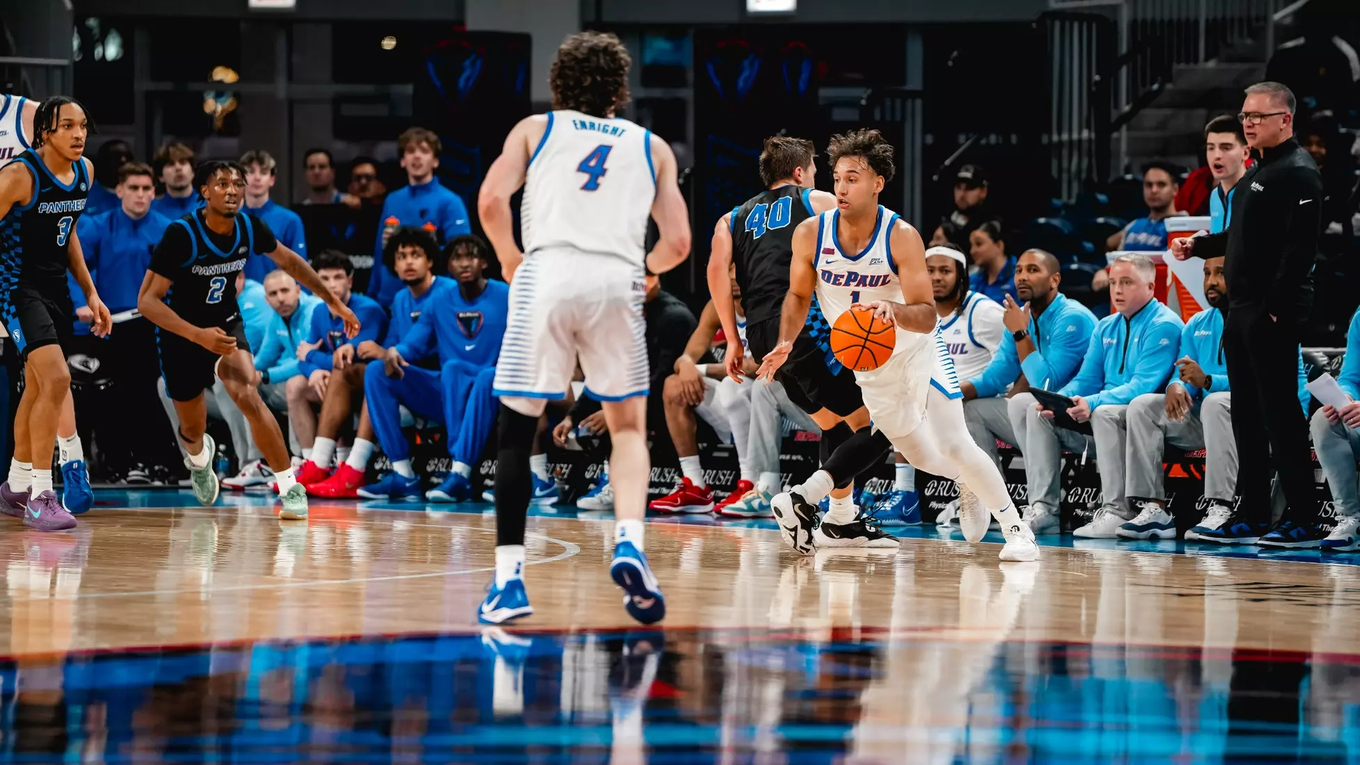 Isaiah Rivera dribbles the basketball