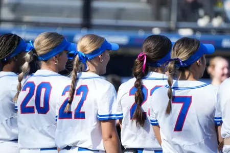 Backs of DePaul softball student-athletes
