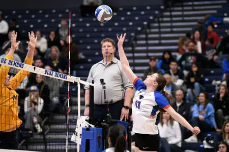 Aly Kindelberger attacks volleyball