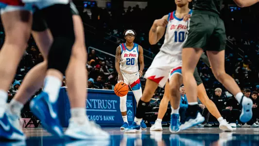 Shakara McCline dribbles basketball
