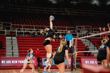 Jill Pressly attacking volleyball