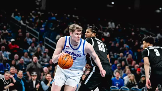 David Skogman dribbles to the basket to score