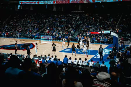 Wide shot of Wintrust Arena as a player goes up for a layup