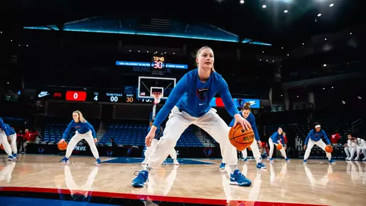 Jorie Allen and her teammates warmup together before game against UNLV.