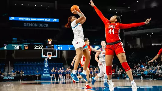 Taylor Johnson-Matthews takes a fadeaway mid-range jump shot.