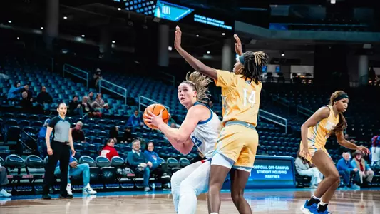 Jorie Allen attempts layup.