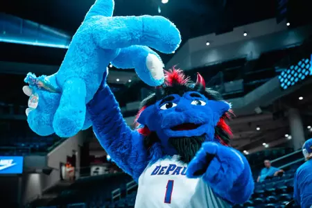 DIBS holds up stuffed animal from the Teddy Bear Toss at halftime vs. Southern.