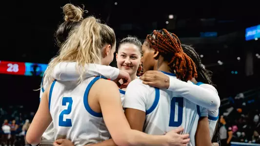 DePaul huddles before play.