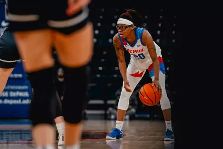 Shakara McCline reads the defense at the top of the key.