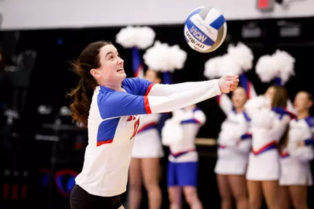 Nora Mannion digs the volleyball