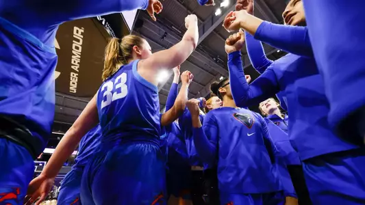 The Blue Demons huddle postgame.