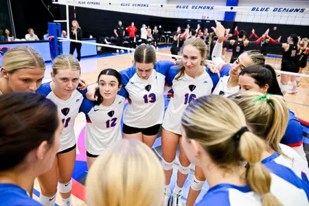 DePaul volleyball team huddle