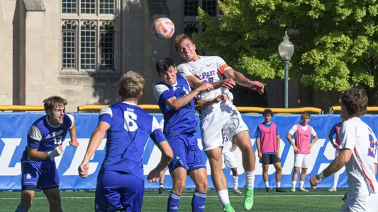 Christian Baumgartner goes up for a header against Drake