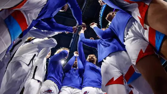DePaul women's basketball huddles prior to facing Marquette.