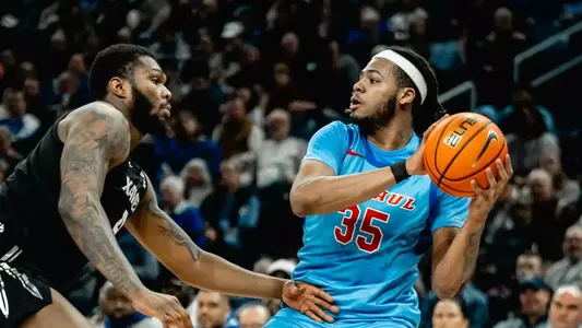 NJ Benson looks for a teammate to pass to