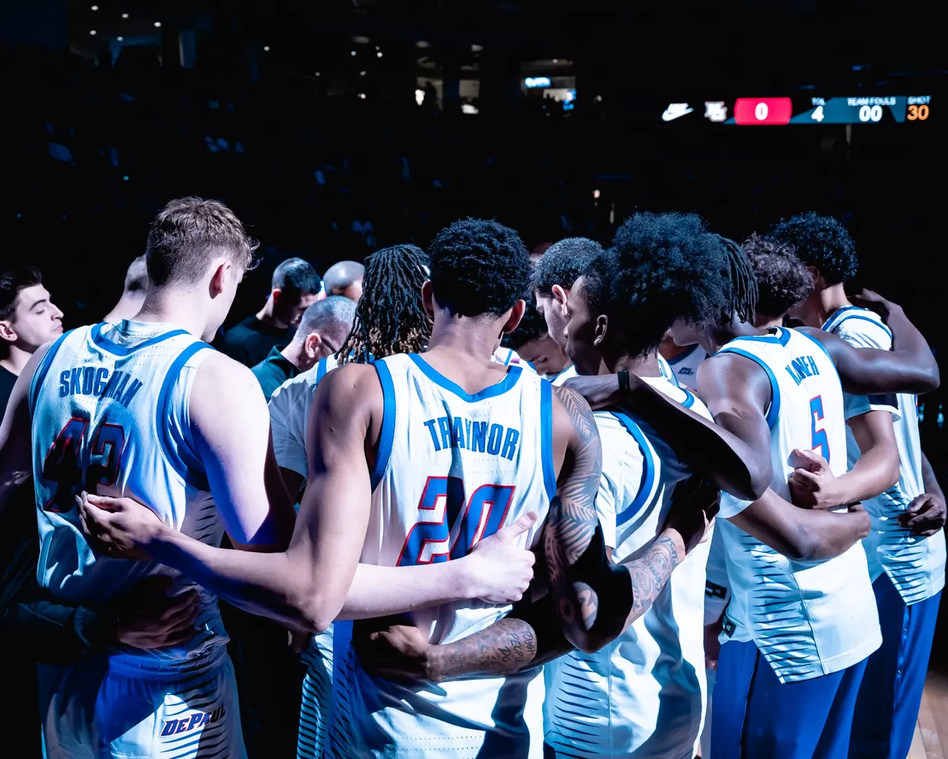 DePaul huddles before the game.