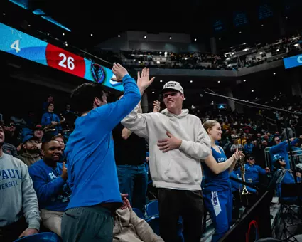 DePaul fans celebrate during game.