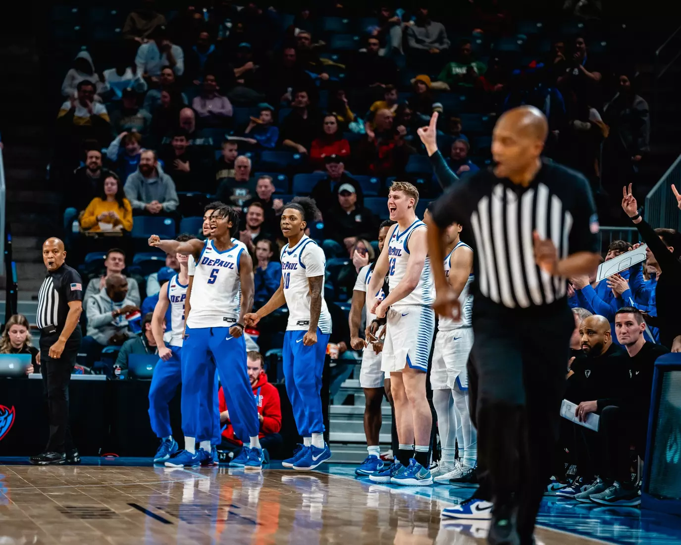 The DePaul bench celebrates after a play.