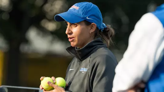 Marisa Arce talking to players at practice