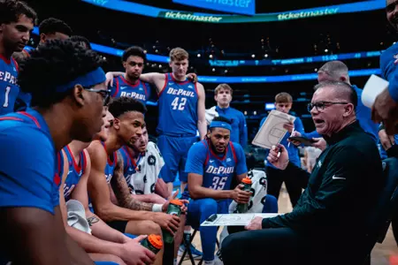 Chris Holtmann talks to team during a timeout at Georgetown on Friday, Jan. 17