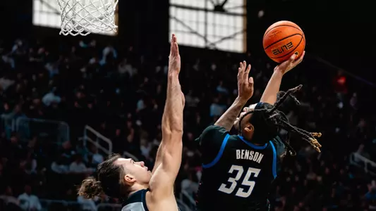 nj benson lays up the basket