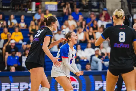 Eva Hurrle celebrates after winning a point