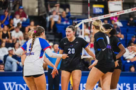 Kendall Timme celebrates with her team after a point