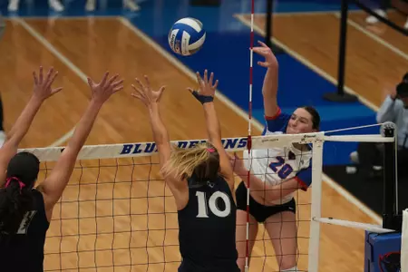 Kendall Timme attacks the volleyball inside McGrath-Phillips Arena