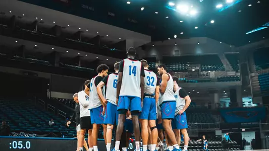 team huddle at Wintrust Arena in practice jerseys