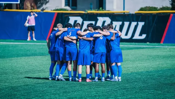The Blue Demons huddle before a match versus Creighton.