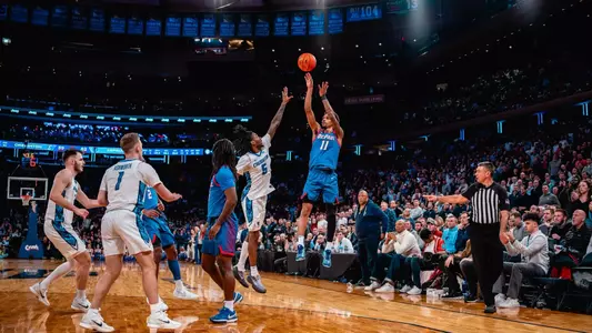 CJ Gunn shoots a three-pointer