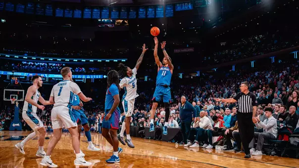 CJ Gunn shoots a three-pointer