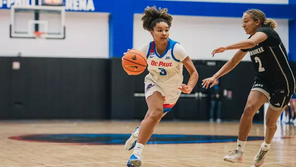 Alayna West drives through the paint