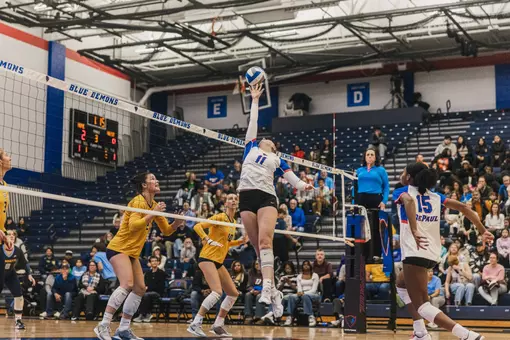 Amanda Saeger jumps up to keep the ball alive