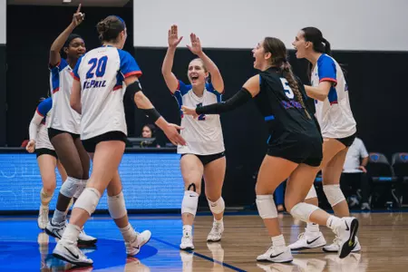 Abby Cahill celebrates with her team after winning a point