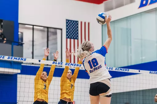 Morgan Stewart goes up for an attack at the net