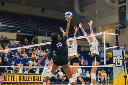 Jade Dudley-Epps goes up for a kill at the net
