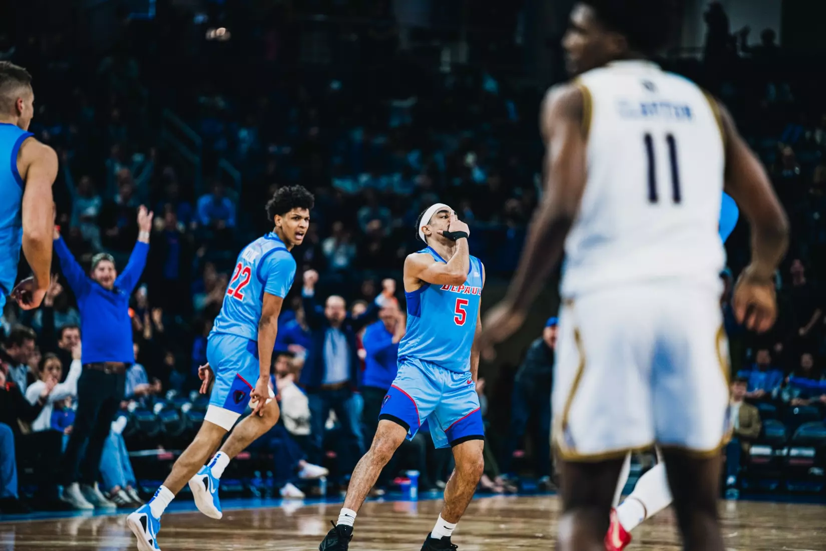 RJ Smith and Kruz McClure celebrate on court