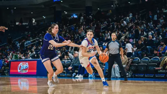Kate Novik drives down the court.