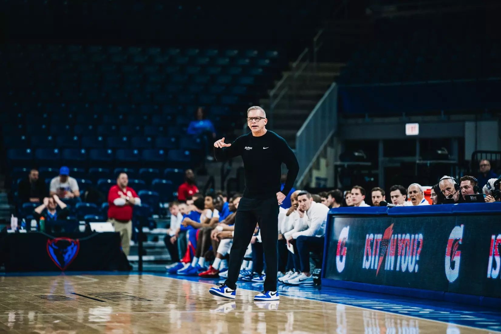 Christ Holtmann looks on.