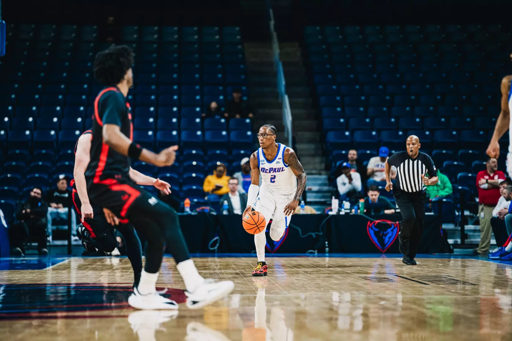 Layden Blocker dribbles up the floor against Garder-Webb.