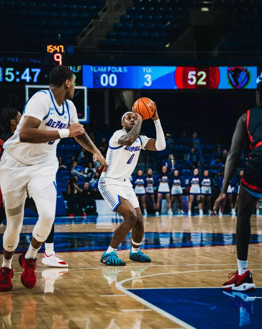 Brandon Maclin attempts a shot from distance.