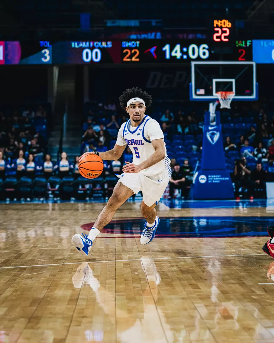 RJ Smith drives through the lane versus Garder-Webb.