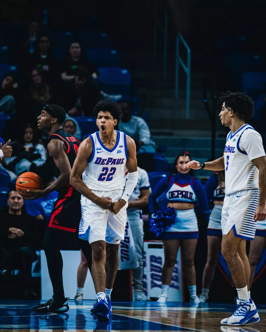 Kruz McClure celebrates a bucket against Garder-Webb.