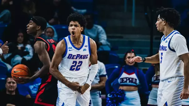 Kruz McClure celebrates a bucket against Garder-Webb.