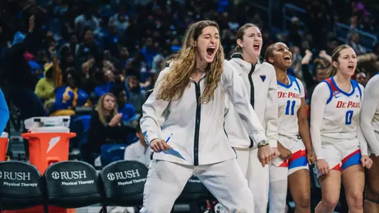 Meg Newman gets hyped on the DePaul's bench.