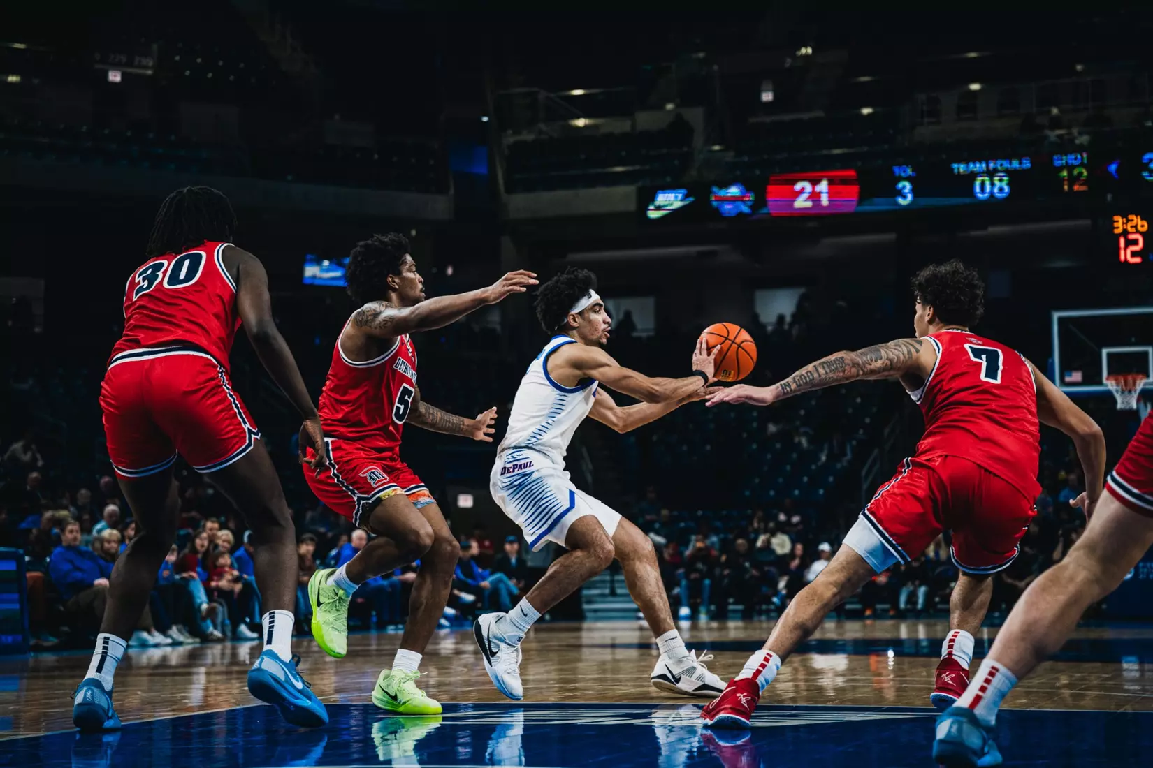 RJ Smith setting up a 3-point shot.